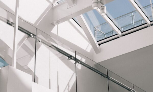 low-angle-shot-modern-building-interior-with-white-walls-touching-sky (1)-min